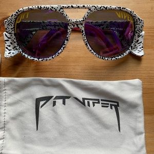 Pit Viper polarized sunglasses: White with zebra stripes and neon accents.